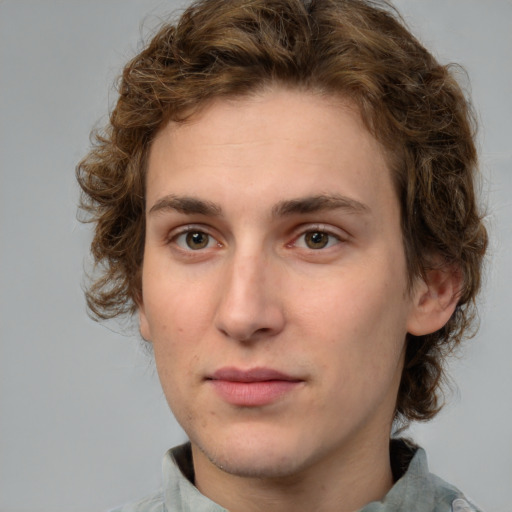 Neutral white young-adult male with medium  brown hair and green eyes