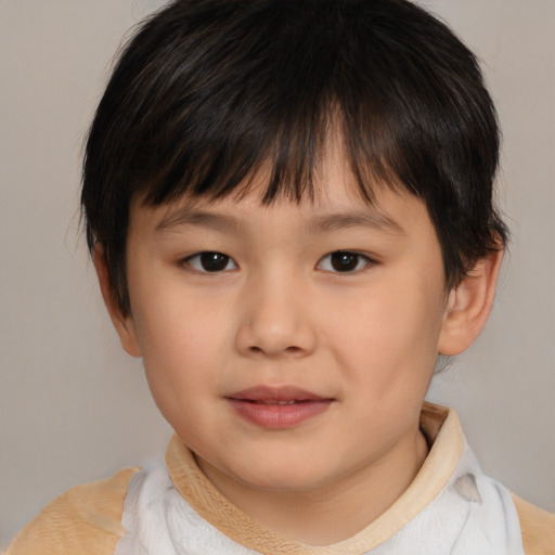 Joyful white child male with medium  brown hair and brown eyes