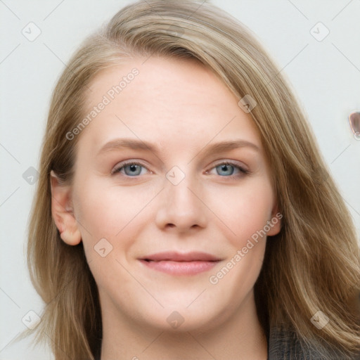 Joyful white young-adult female with long  brown hair and blue eyes