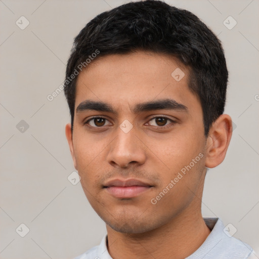 Neutral latino young-adult male with short  black hair and brown eyes