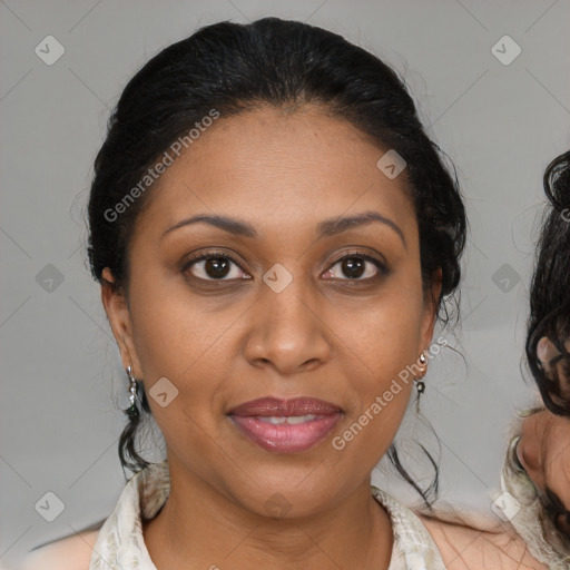 Joyful black adult female with medium  brown hair and brown eyes