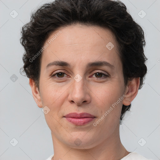 Joyful white adult female with short  brown hair and brown eyes