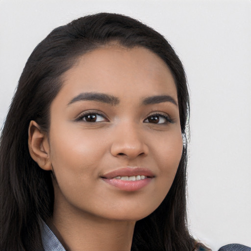 Joyful latino young-adult female with long  black hair and brown eyes