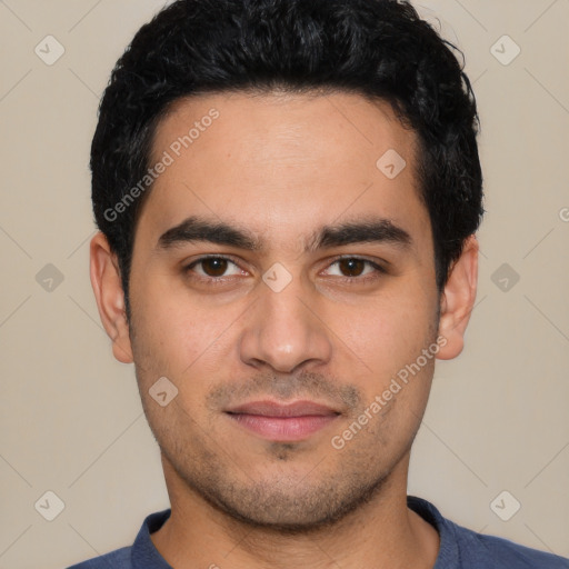 Joyful white young-adult male with short  black hair and brown eyes