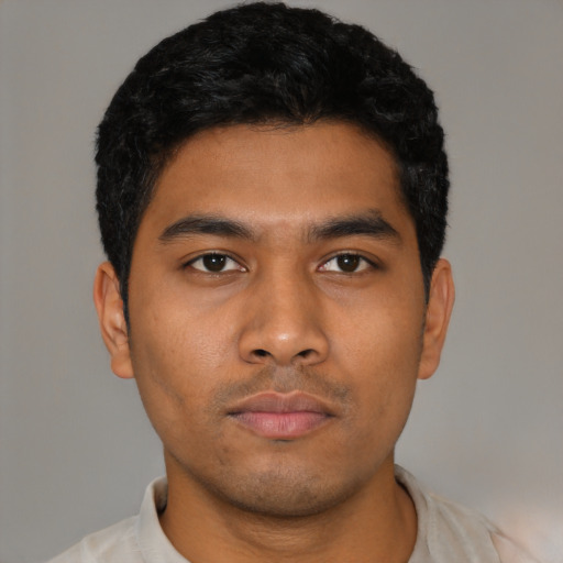 Neutral latino young-adult male with short  black hair and brown eyes