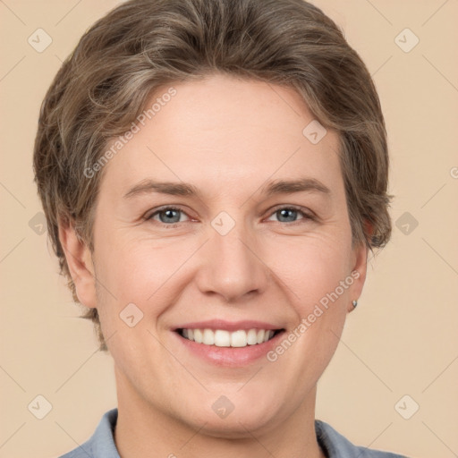 Joyful white adult female with short  brown hair and grey eyes