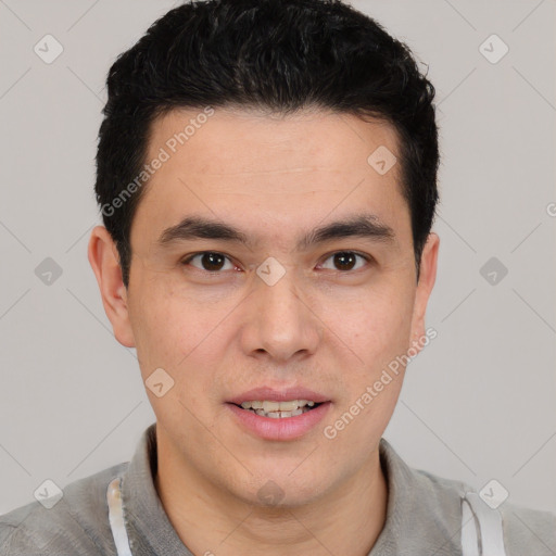 Joyful white young-adult male with short  black hair and brown eyes