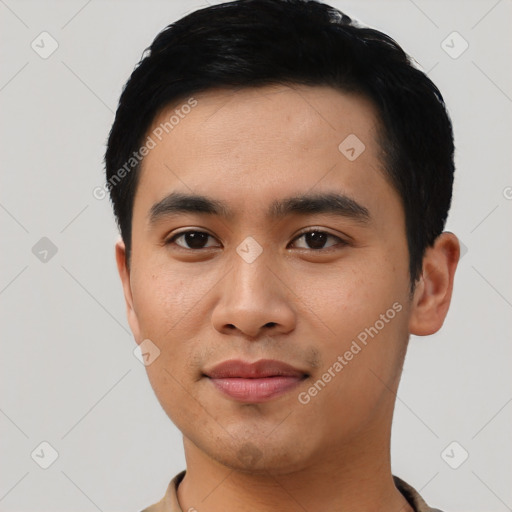 Joyful asian young-adult male with short  black hair and brown eyes