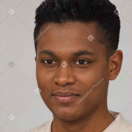 Joyful black young-adult male with short  black hair and brown eyes