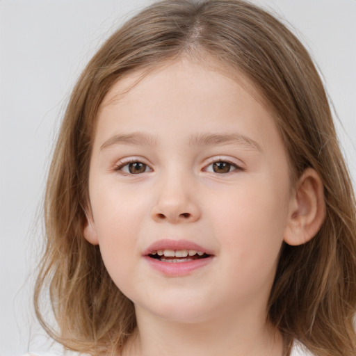 Joyful white child female with medium  brown hair and brown eyes