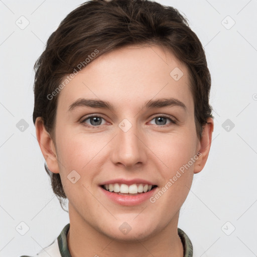 Joyful white young-adult female with short  brown hair and grey eyes