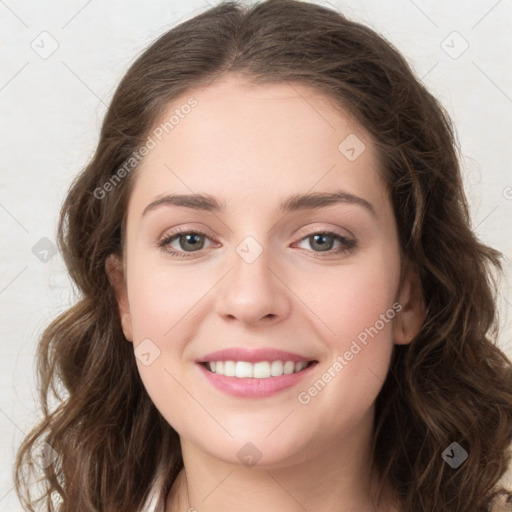 Joyful white young-adult female with long  brown hair and green eyes