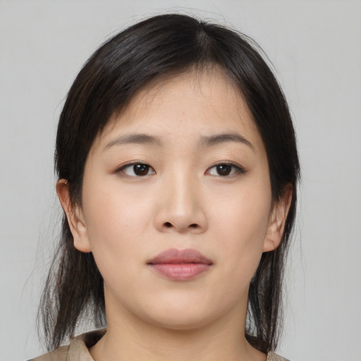 Neutral asian young-adult female with medium  brown hair and brown eyes