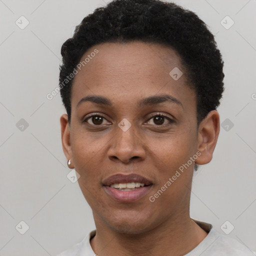 Joyful black young-adult female with short  black hair and brown eyes