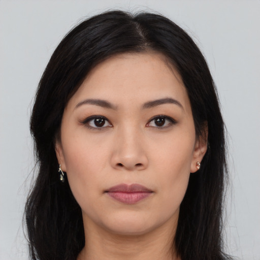 Neutral asian young-adult female with long  brown hair and brown eyes