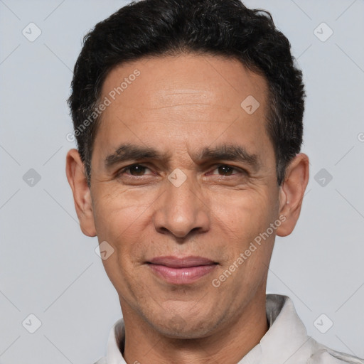 Joyful white adult male with short  black hair and brown eyes