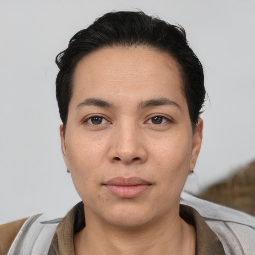 Neutral white young-adult female with short  black hair and brown eyes