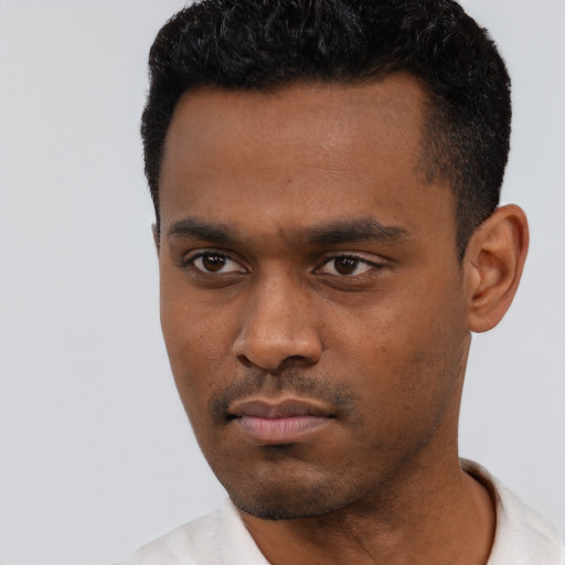 Neutral black young-adult male with short  black hair and brown eyes