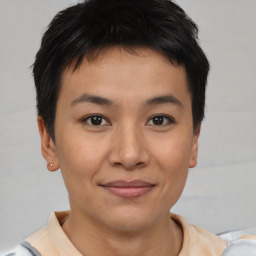 Joyful asian young-adult male with short  brown hair and brown eyes