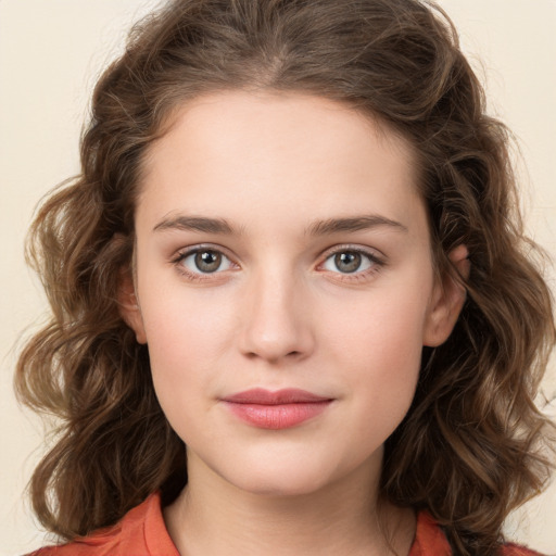 Joyful white young-adult female with medium  brown hair and green eyes