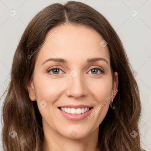 Joyful white young-adult female with long  brown hair and green eyes