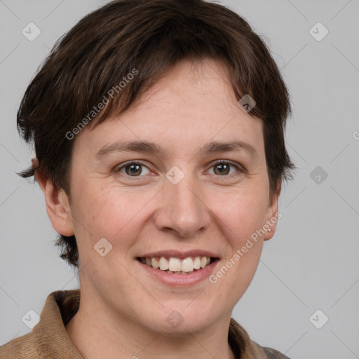 Joyful white adult female with short  brown hair and grey eyes