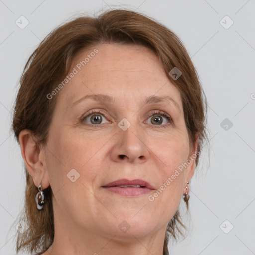 Joyful white adult female with medium  brown hair and grey eyes