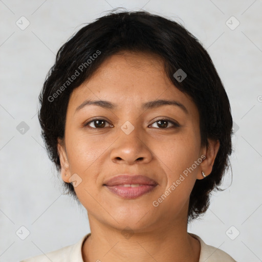 Joyful latino young-adult female with short  brown hair and brown eyes