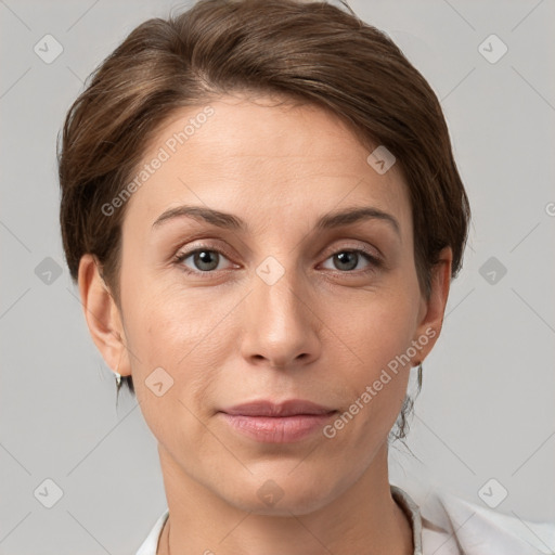 Joyful white young-adult female with short  brown hair and grey eyes