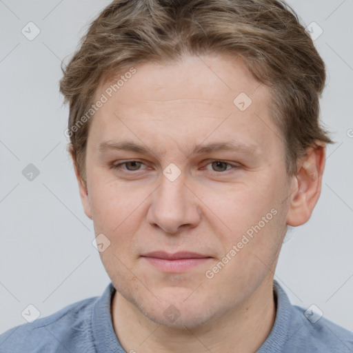 Joyful white adult male with short  brown hair and grey eyes