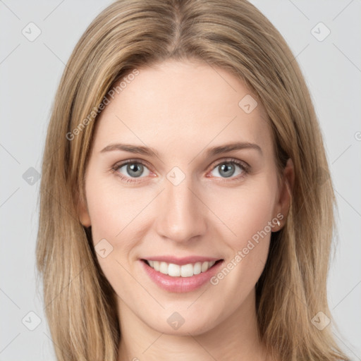 Joyful white young-adult female with long  brown hair and green eyes