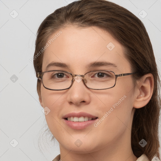 Joyful white young-adult female with medium  brown hair and grey eyes