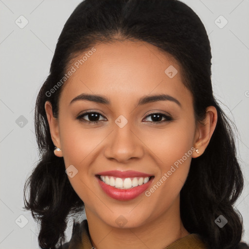 Joyful latino young-adult female with long  brown hair and brown eyes