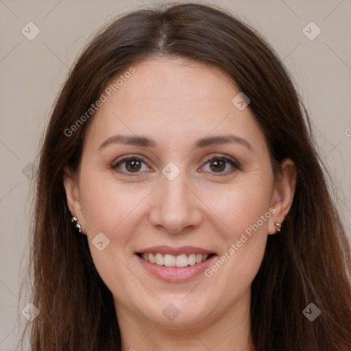 Joyful white adult female with long  brown hair and brown eyes