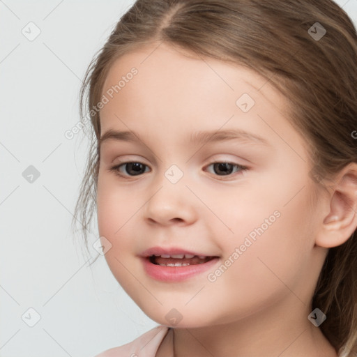 Joyful white child female with medium  brown hair and brown eyes