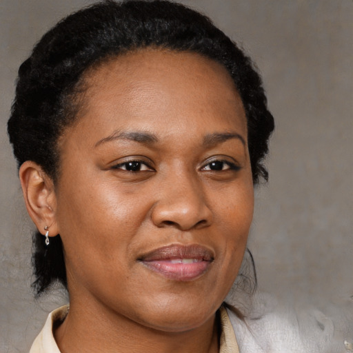 Joyful black young-adult female with medium  brown hair and brown eyes