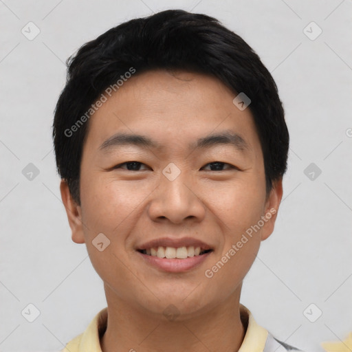 Joyful asian young-adult male with short  black hair and brown eyes