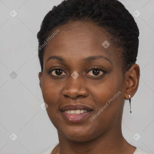 Joyful black young-adult female with short  brown hair and brown eyes