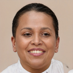 Joyful white adult female with short  brown hair and brown eyes