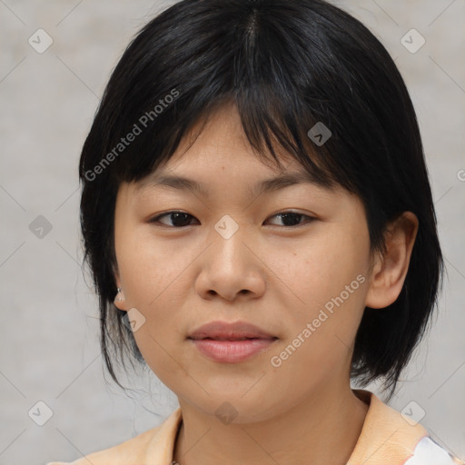 Joyful asian young-adult female with medium  brown hair and brown eyes