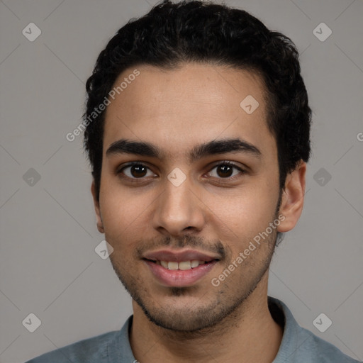 Joyful white young-adult male with short  black hair and brown eyes