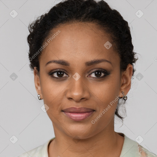 Joyful black young-adult female with short  black hair and brown eyes