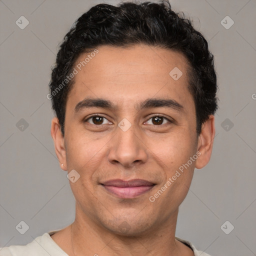 Joyful white young-adult male with short  black hair and brown eyes