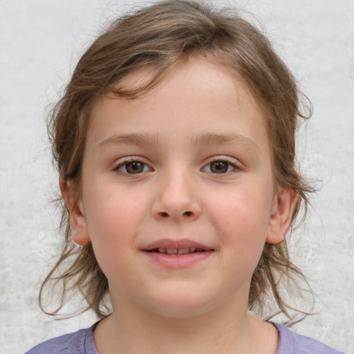 Joyful white child female with medium  brown hair and grey eyes