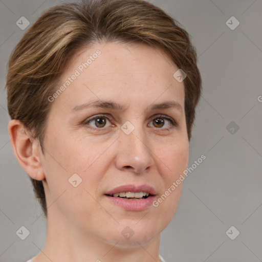 Joyful white adult female with short  brown hair and grey eyes