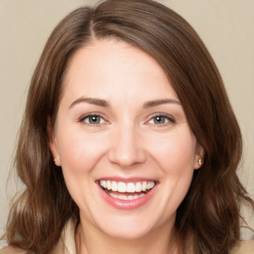 Joyful white young-adult female with medium  brown hair and brown eyes