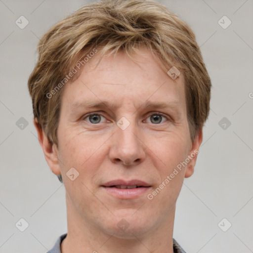 Joyful white adult male with short  brown hair and grey eyes