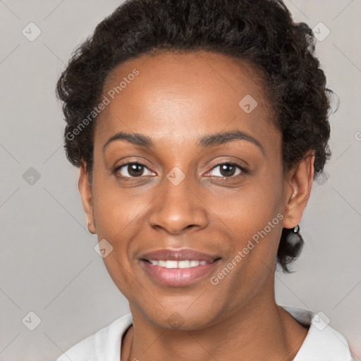 Joyful black young-adult female with short  brown hair and brown eyes