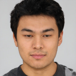 Neutral asian young-adult male with short  brown hair and brown eyes