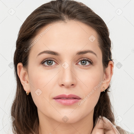 Joyful white young-adult female with medium  brown hair and grey eyes